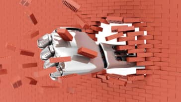 Metal Robotic Hand Breaking Through From Brick Wall